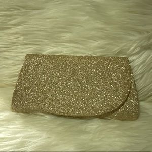 Gold glittery clutch